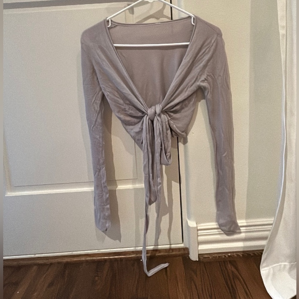 lululemon athletic sweater with strands to tie around waist or tie upfront.
